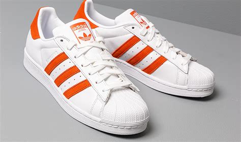 Adidas orange and white shoes